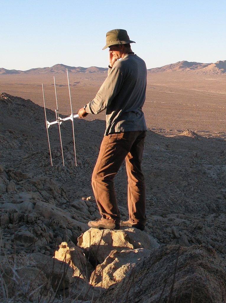 Biologist with radio telemetry antenna